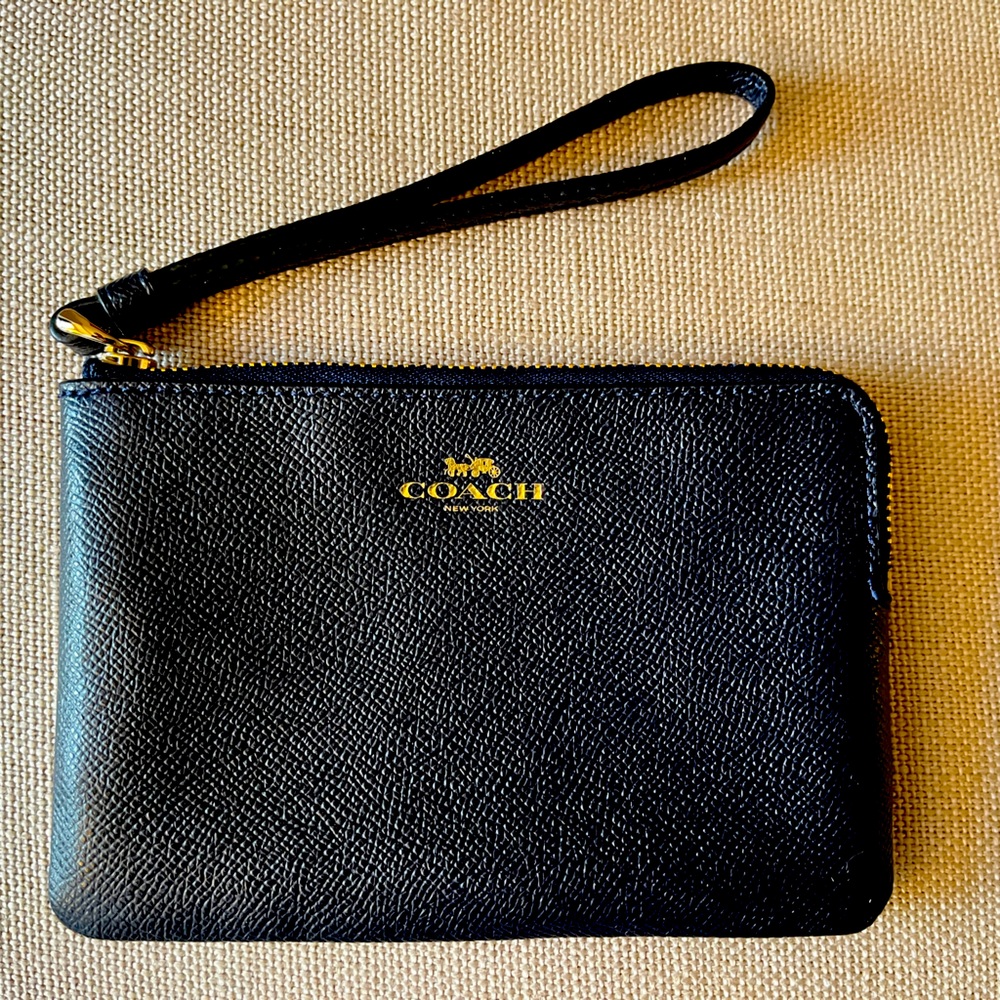 COACH, Wrist wallet, black pebble leather, lined, with leather wrist strap.